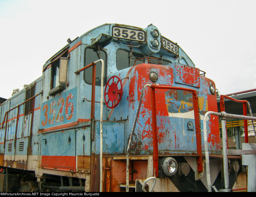 FXE C30-7 Locomotive in the yard with faded paint scheme